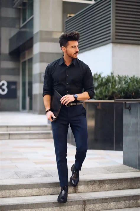 blue shirt with black pants.